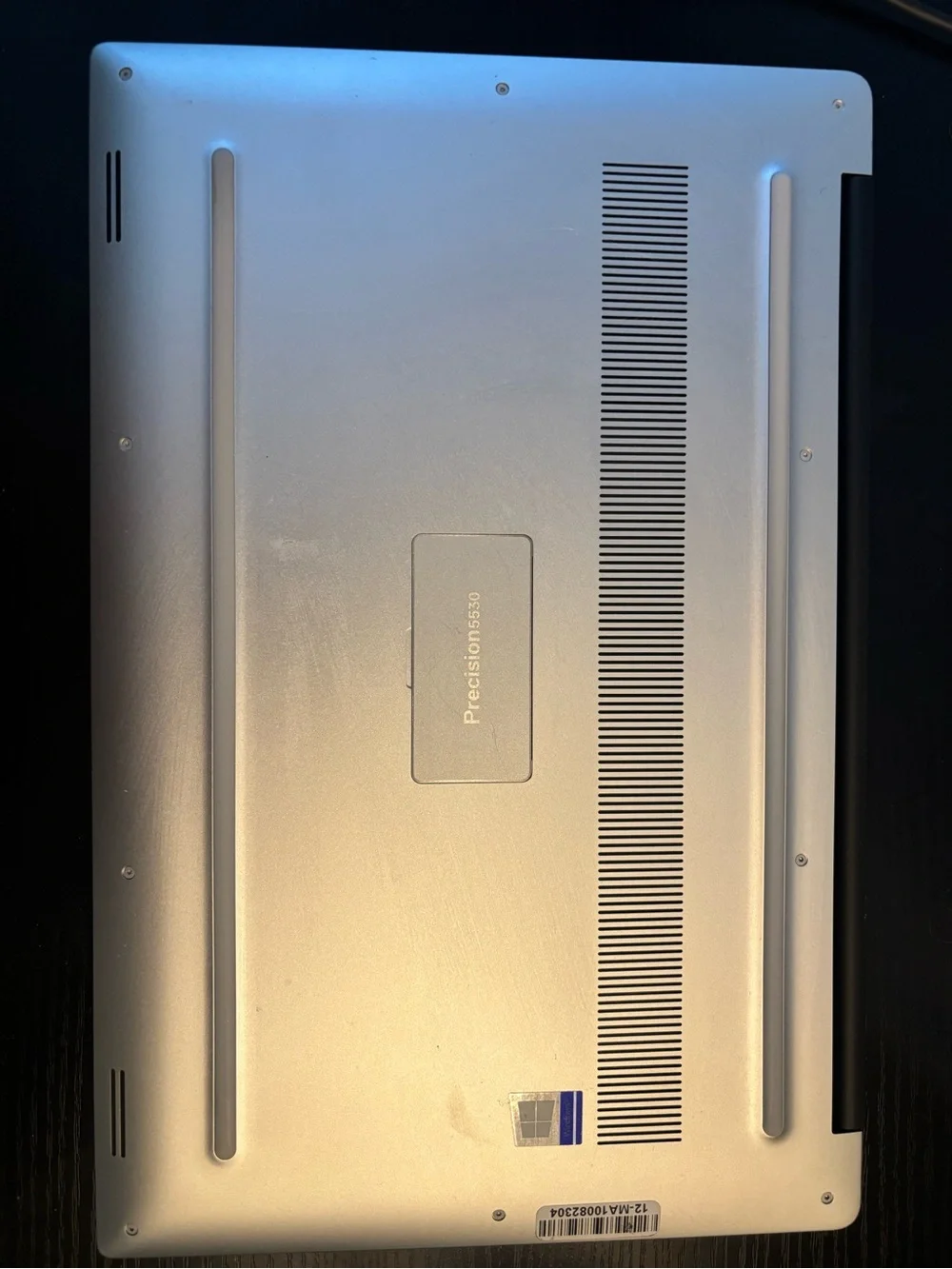 Dell Laptop with Black Chassis and Silver Keyboard Trim